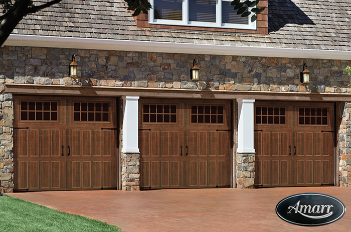 A newly installed carriage-style garage door on a New England home